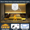 Warm white motion activated LED strip lights with a chasing neon effect illuminating a room.
