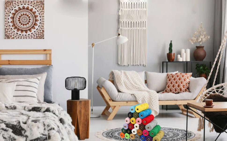 A cozy living room scene featuring a light wood sofa, pillows, and a macrame plant hanger.