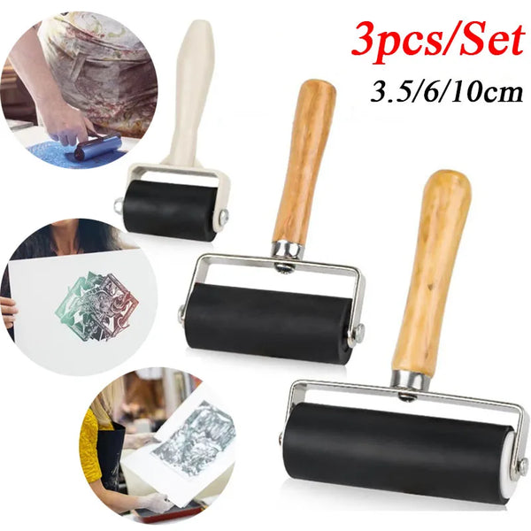 A set of three wooden-handled rubber roller printing tools with black rollers, measuring 3.5/6/10cm.