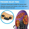 A close-up of a purple shoe showing pressure relief pods placed on the sole for foot pain relief.