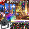 A black rotatable LED Christmas projector light with multiple patterns illuminating a festive scene.