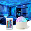 A white projector emitting purple and blue light ripples onto a dark room setting.