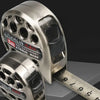 Stainless steel metric tape measure with a cylindrical object and a ruler shown in a close-up view