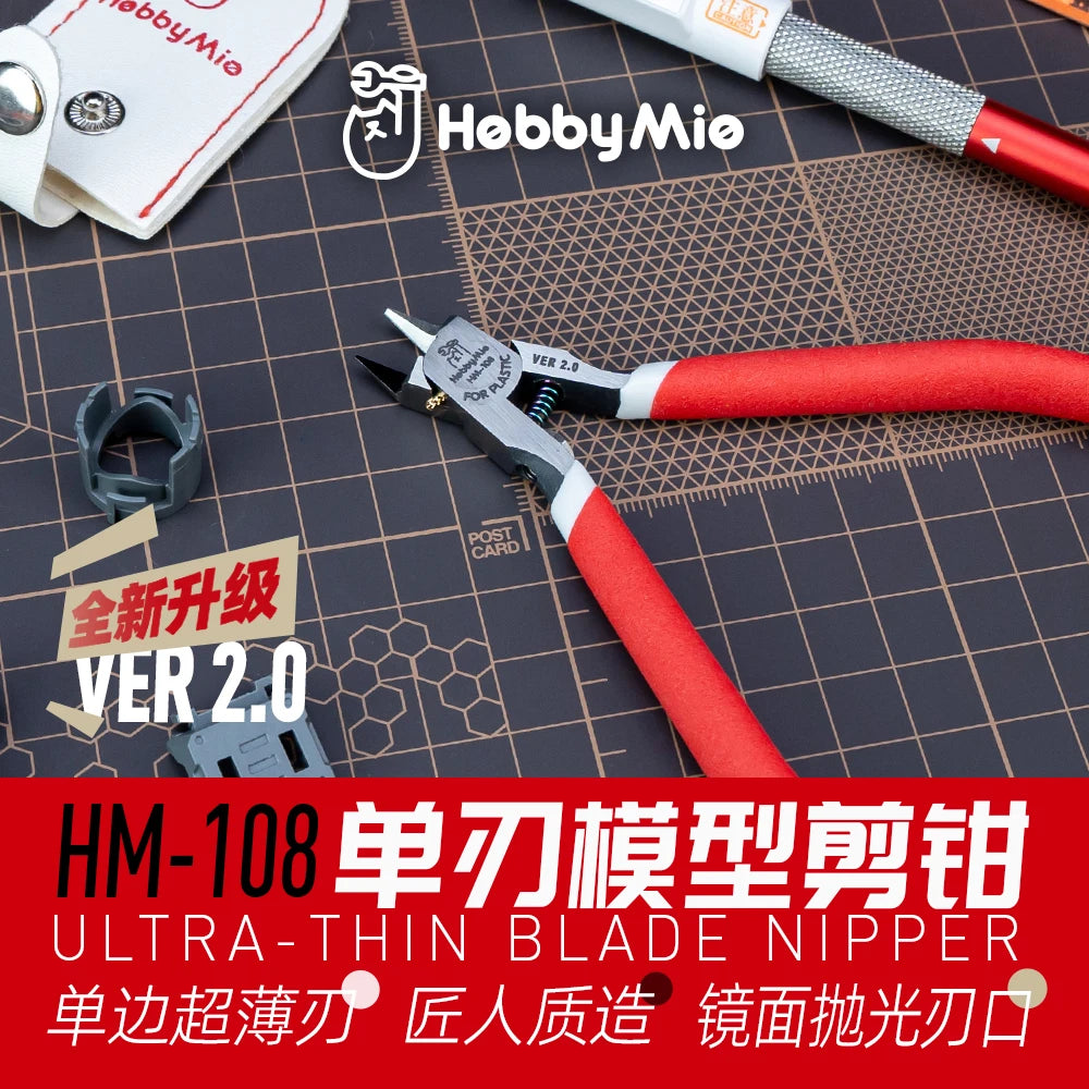 A close-up of an HM-108 ultra-thin blade nipper tool resting on a dark surface next to a hobby nipper.