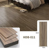 Close-up of brown wood grain floor tiles installed in a room, showing texture and plank dimensions.