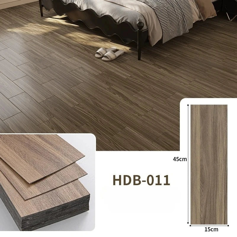 Close-up of brown wood grain floor tiles installed in a room, showing texture and plank dimensions.