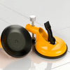 A yellow heavy duty wall tile leveler with a suction cup is shown on a white surface.