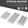 A set of silver refrigerator magnets with cylindrical shapes shown on a dark gray background.