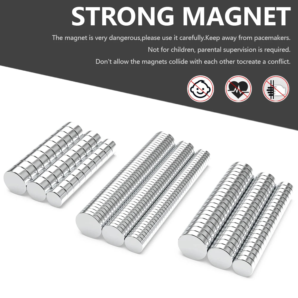 A set of silver refrigerator magnets with cylindrical shapes shown on a dark gray background.