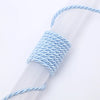 A close-up of a light blue braided cord wrapped around a clear plastic tube.