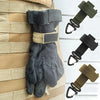 A pair of dark gray tactical nylon climbing gloves are shown being worn on a person's hand.