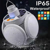 A white solar rechargeable LED camping torch is shown being used in water, highlighting its IP65 waterproof rating.