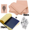 A set of professional tattoo practice skin and transfer kits including pink sheets, a yellow roll, and a white floral design.