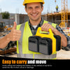 A smiling man wearing a safety vest holds a yellow portable battery storage organizer.
