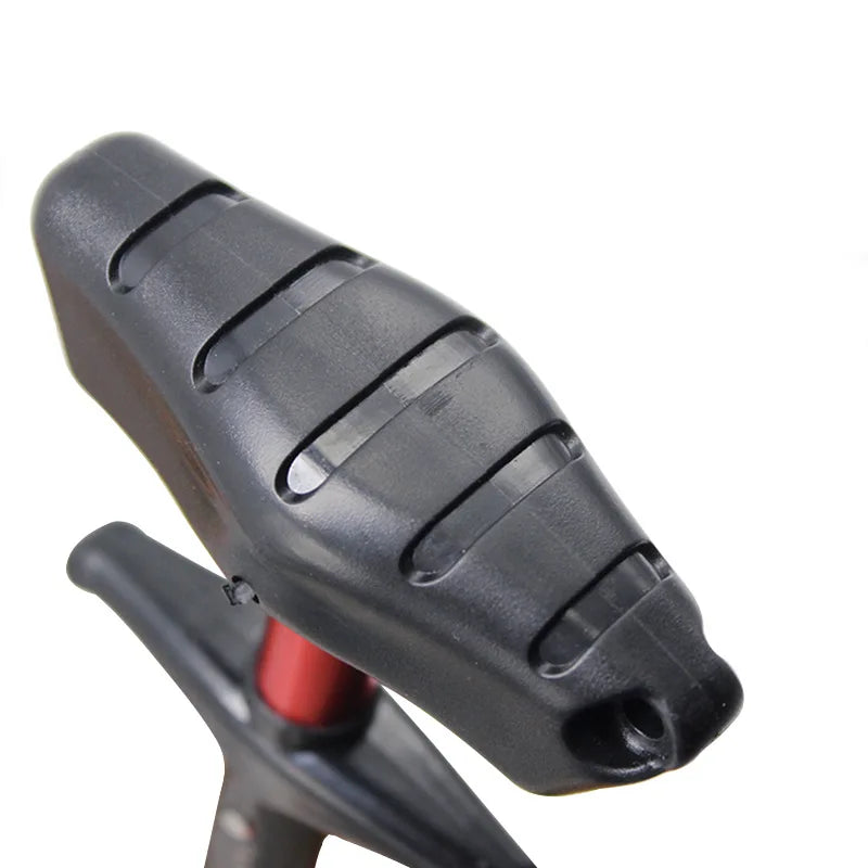 A close-up view of a black portable aluminum T-hook remover tool.