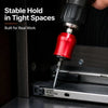 A hand is using a red magnetic screwdriver bit to work inside a dark enclosure.