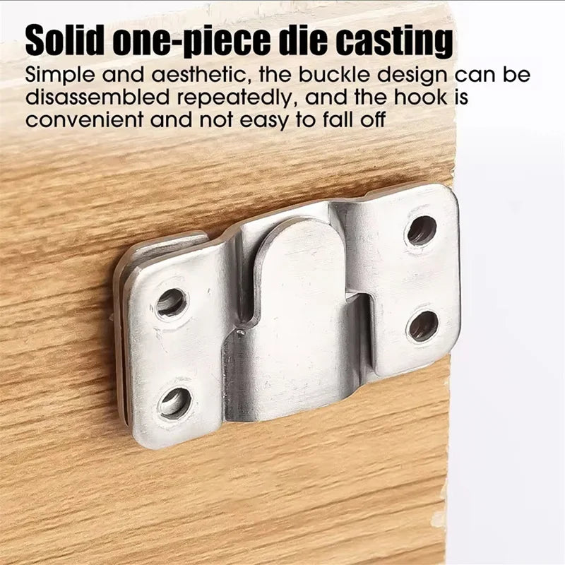 A close-up view of a solid one-piece die casting metal hook used for hanging picture frames.