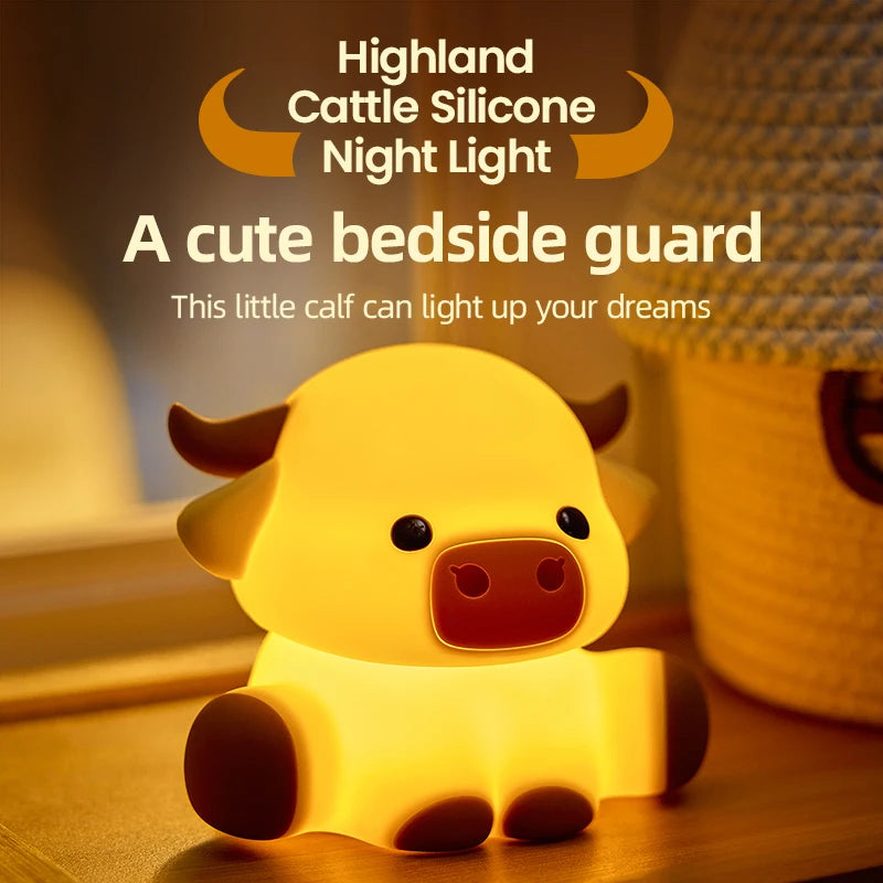 A cute yellow Highland cattle silicone night light shaped like a calf, illuminating a bedside.