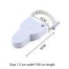 A white portable telescopic health tape measure is shown next to a ruler for scale.