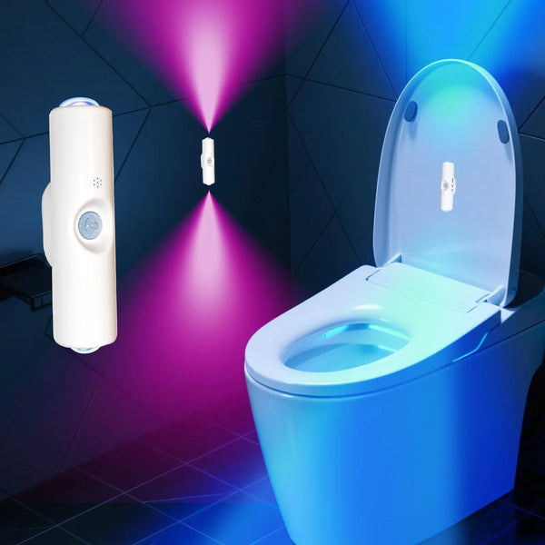 A smart motion sensor night light illuminates a toilet bowl with a purple and blue glow in a dark room.