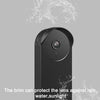 A black doorbell camera with a protective brim is shown against a gray background.