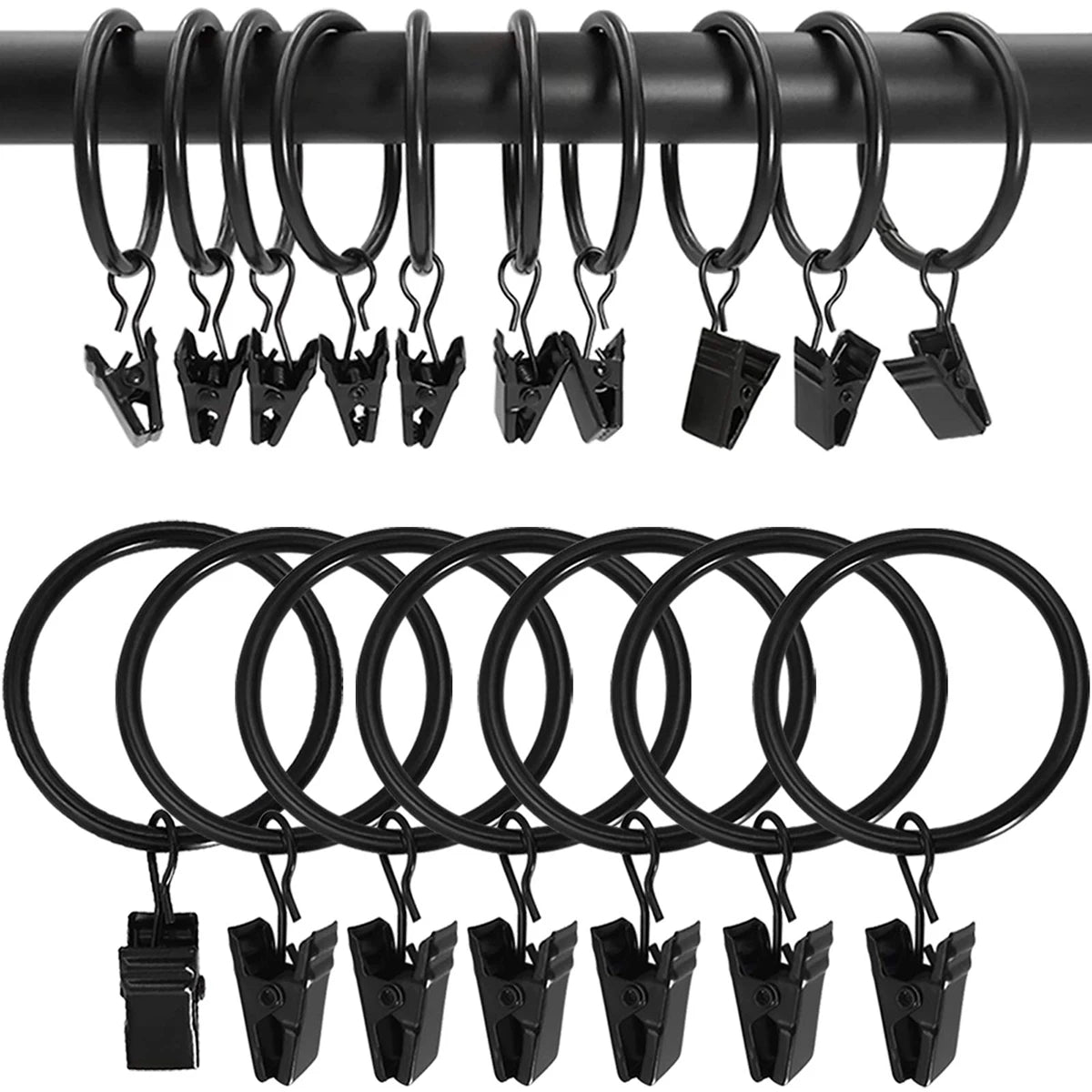 A set of black metal curtain rings and clips hanging from a black rod.