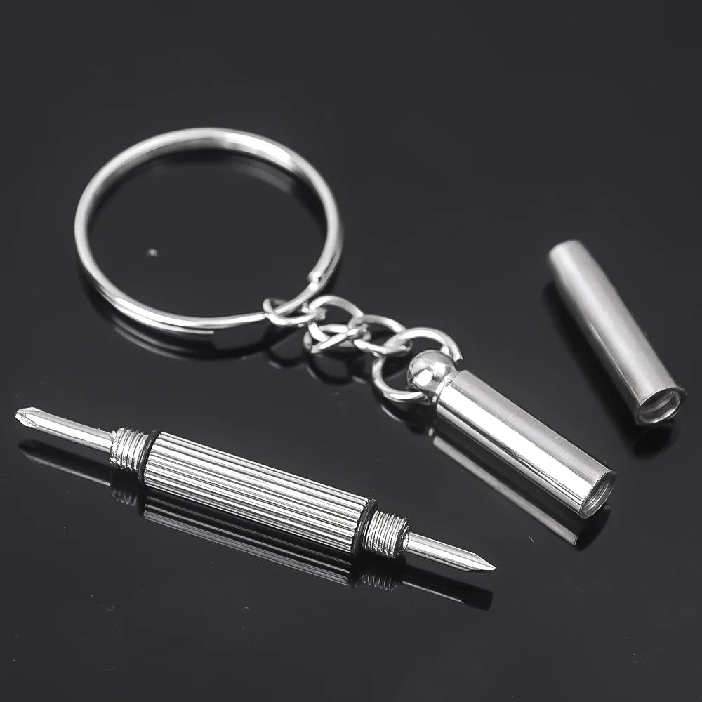Silver adjustable silicone eyeglass nose pads attached to a screwdriver