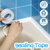 Hands applying white sealing tape to a tiled surface in a bathroom setting.