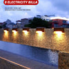 Solar step and stairs lights illuminating an outdoor path with warm yellow light.