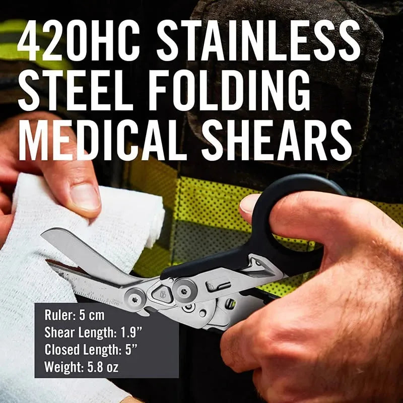 A hand holds a 420HC stainless steel folding medical shear with a ruler for scale.