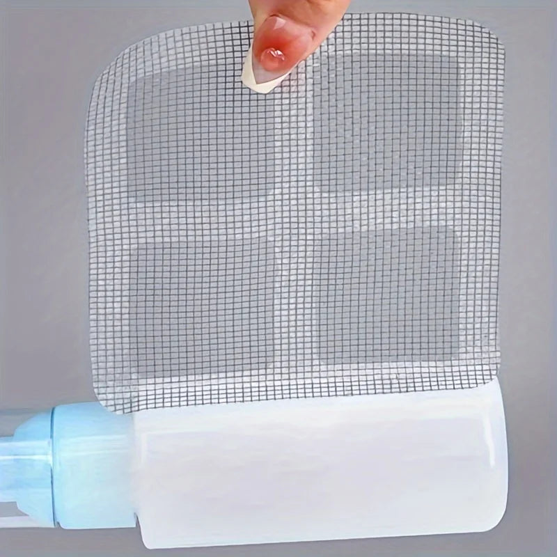 A hand is holding a reusable mesh strainer for bathroom drains, showing its grid pattern.