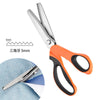 Orange and black professional stainless steel sewing shears with a 5mm measurement mark.
