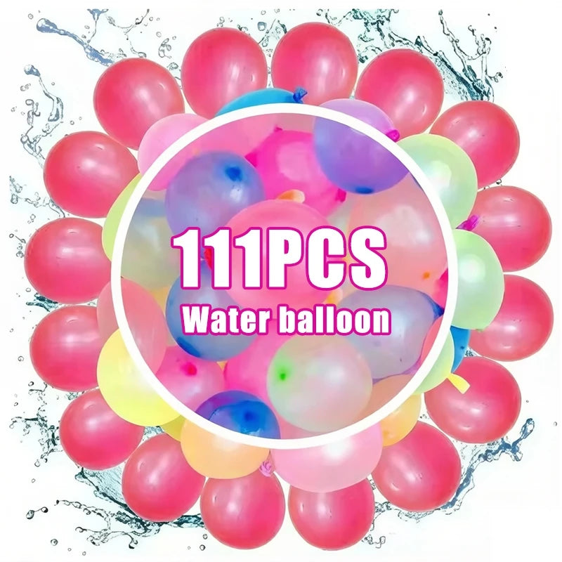A large collection of pink, purple, and green water balloons scattered on a white surface.