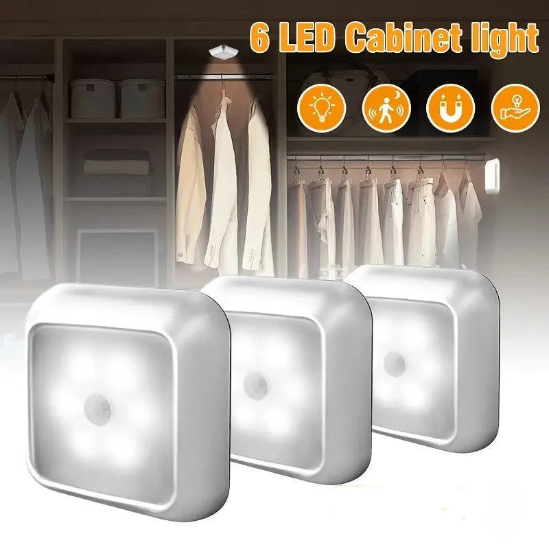 Six LED cabinet lights and a motion sensor night light illuminating a closet interior.
