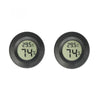 A close-up view of a black digital indoor humidity and temperature meter displaying 29.5°C and 74%.