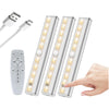 Three long LED light bars with remote controls and a power adapter are shown next to a hand.