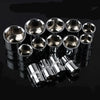 A set of twelve chrome-plated socket wrenches arranged in a row on a dark surface.