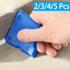 A hand holds a blue silicone caulking tool kit with various sizes for grout and joint sealing.