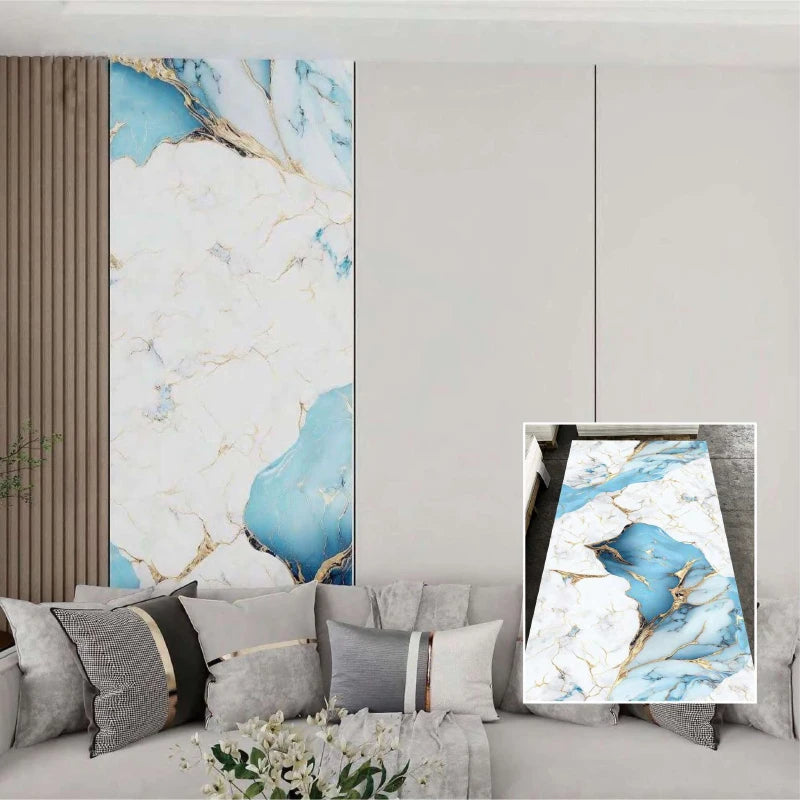 A close-up of marble self-adhesive contact paper featuring blue and gold veining displayed on a wall panel.