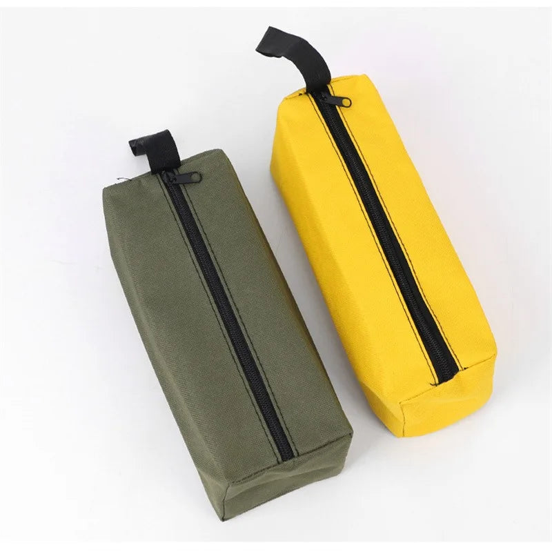 A pair of olive green and yellow Oxford cloth hand-held storage bags with black zippers.