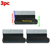 Three rolls of black and silver weather sealing material for door draft stoppers