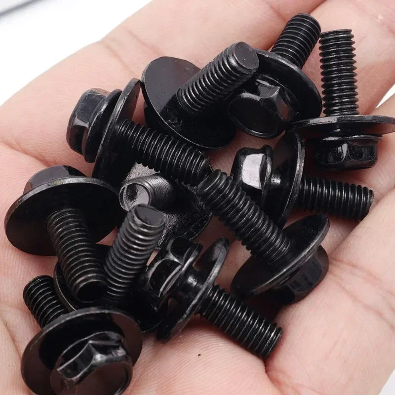 A hand holds several black U-type body bolts and clips for auto fastening.