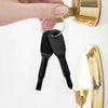 A black 2-piece mini screwdriver set with a keyring is shown hanging from a brass door knob.