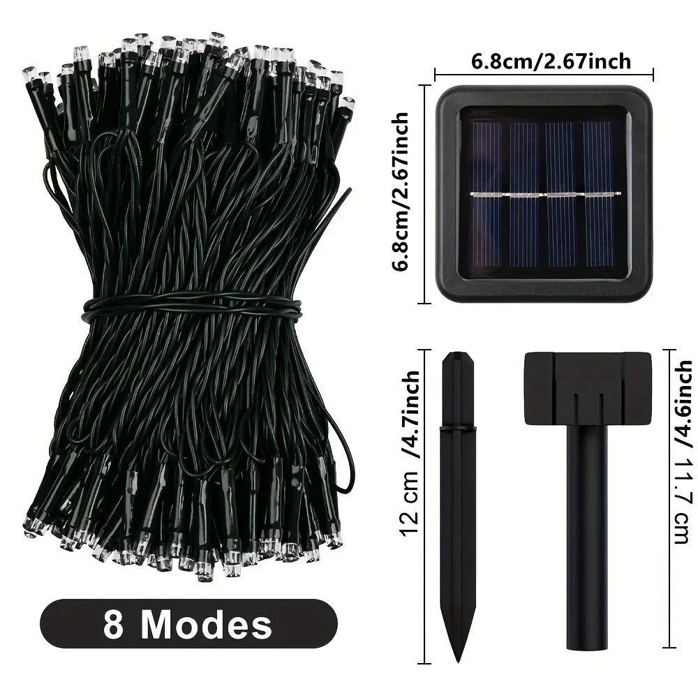 A bundle of black solar powered outdoor LED string lights with individual light heads and a separate light source unit.