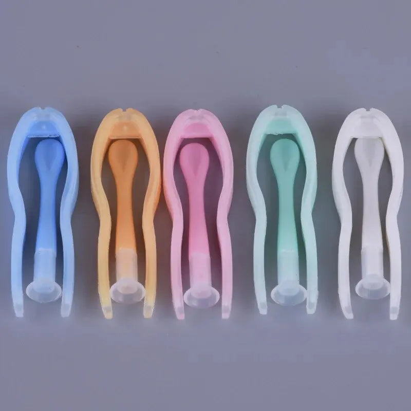 A set of five colored portable contact lens tools, including blue, orange, pink, mint green, and white.