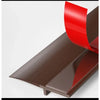 A close-up view of a brown door draft stopper with a red seal strip, showing the profile and material.