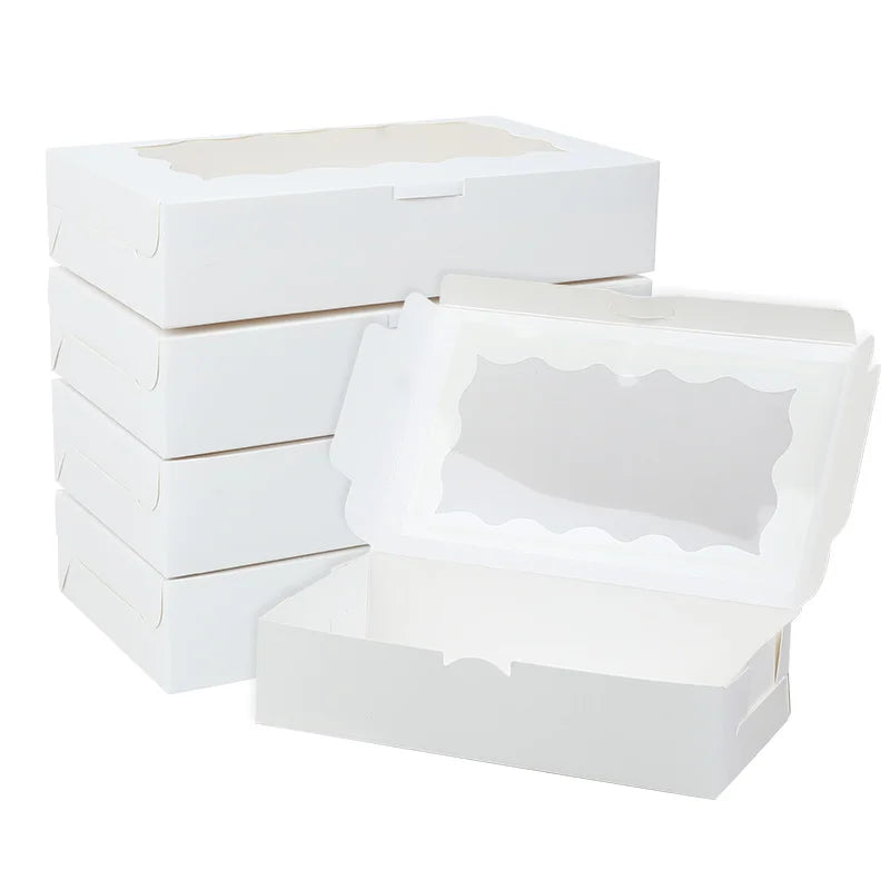 A stack of white decorative gift boxes for parties and events.
