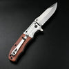 A silver folding utility pocket knife with a wooden handle is shown against a dark background.