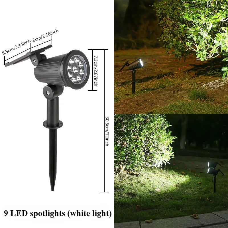 Schwarze LED-Spotleuchte mit neun weißen Leuchtmitteln auf einem Stativ, im Außengartenbereich.
