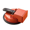 An orange heavy duty suction cup floor gap fixer tool with a black handle and circular base.